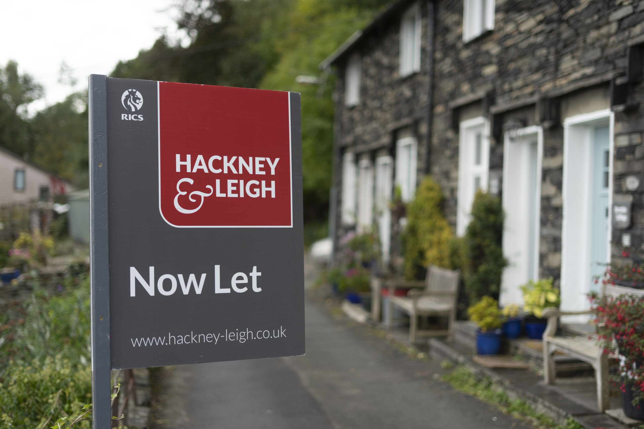 Hackney & Leigh now let board outside of a house