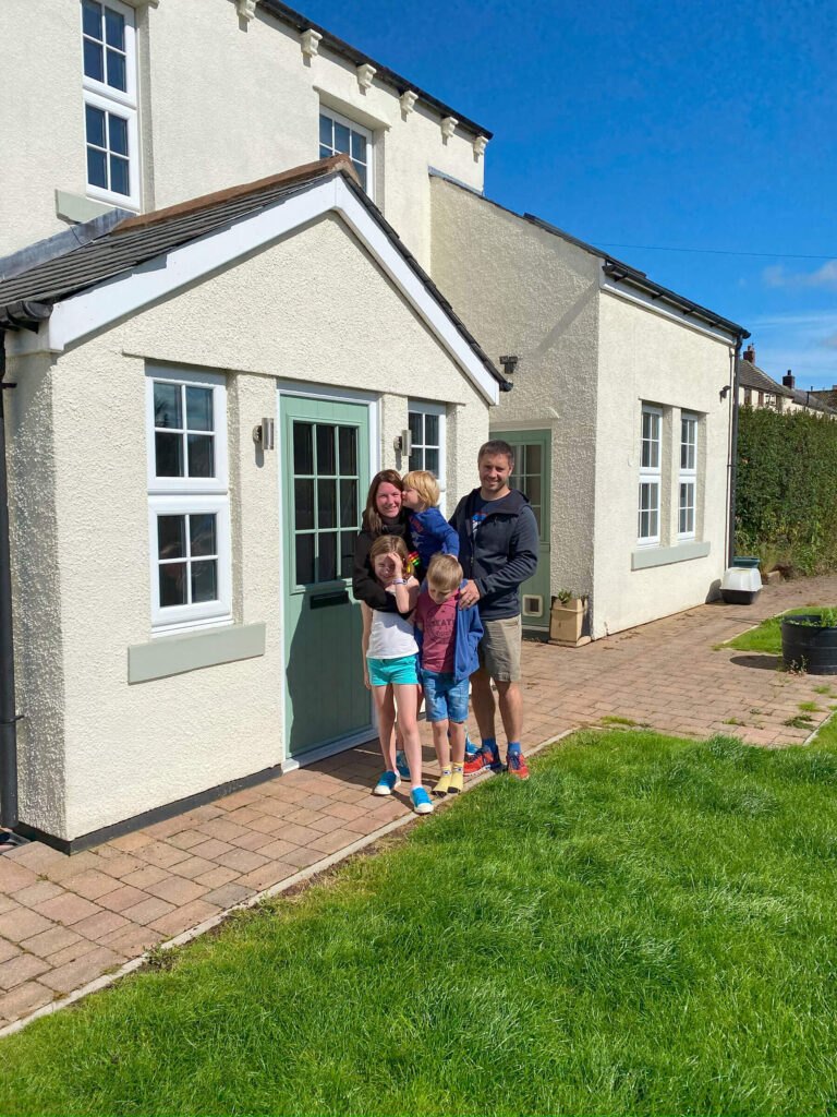 Family stook outside home